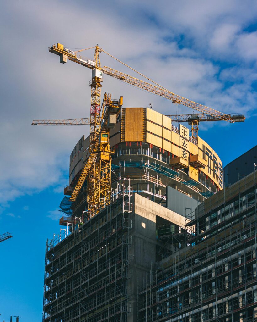 View of a skyscraper under construction with cranes in Bratislava, Slovakia.
