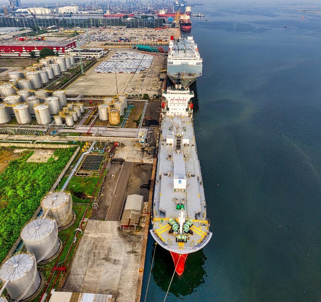 Aerial shot of oil tankers and storage facility in North Jakarta, Indonesia.